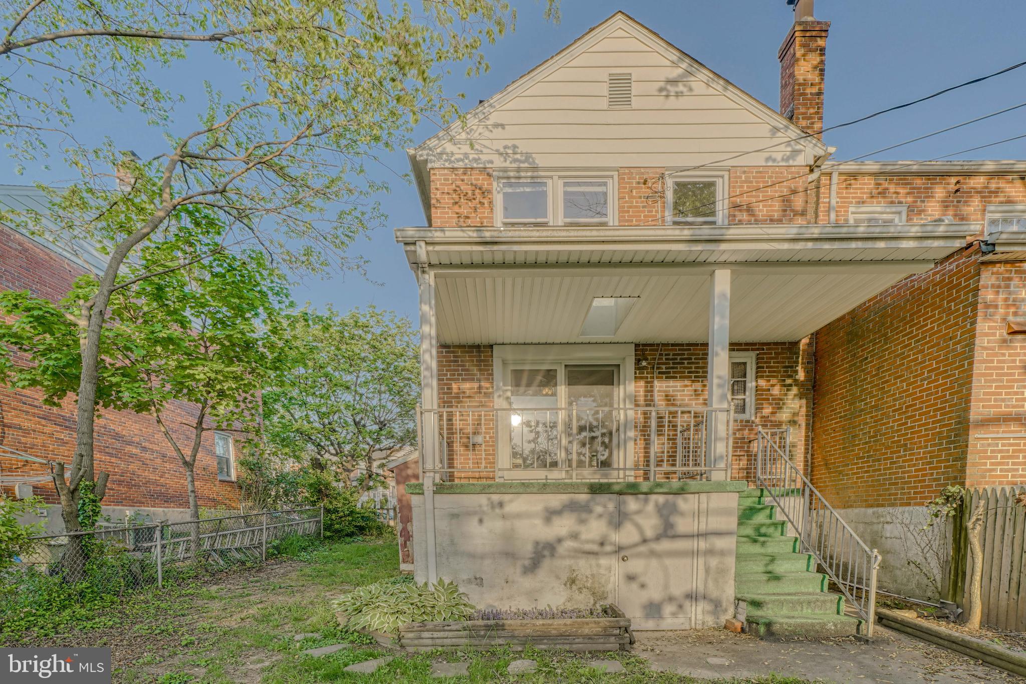 8324 Ridgely Oak Road Parkville, MD 21234 - Photo 5 of 25 a front view of a house with garden