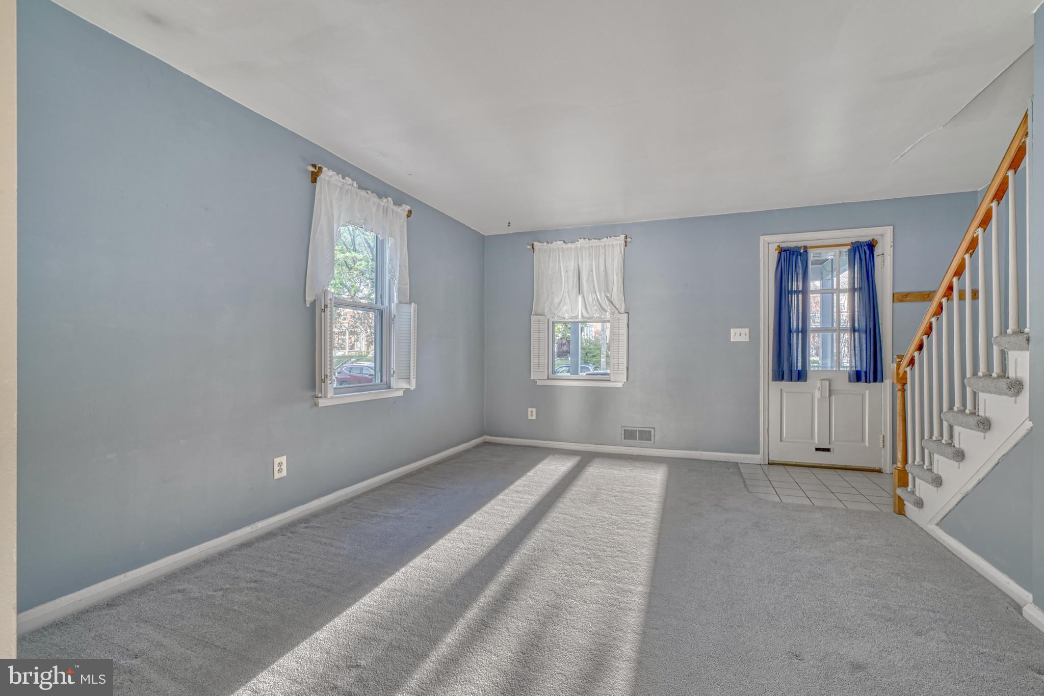 8324 Ridgely Oak Road Parkville, MD 21234 - Photo 8 of 25 a view of an empty room with a window