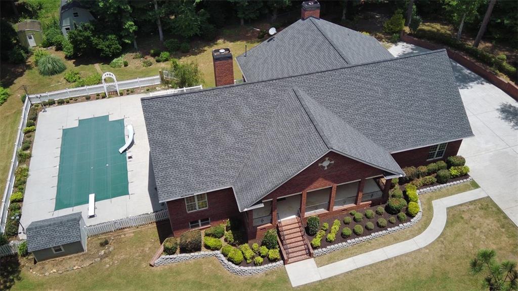9626 West Union Hill Road Villa Rica, GA 30180 - Photo 1 of 1 an aerial view of a house with swimming pool and porch