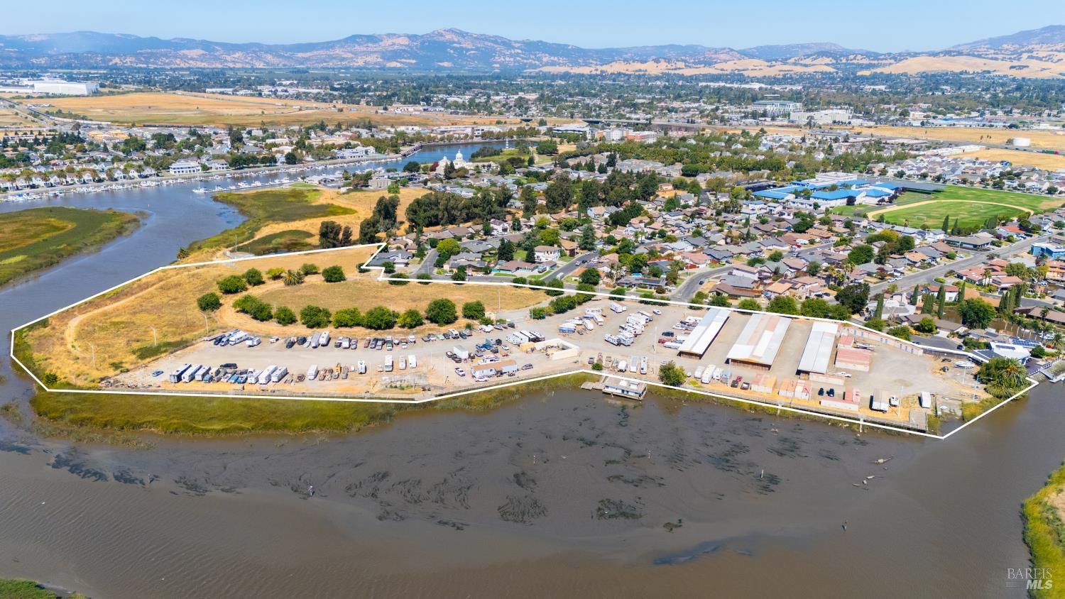 950 Marina Circle Suisun City, CA 94585 - Photo 23 of 47 an aerial view of a house with a swimming pool a yard and lake view