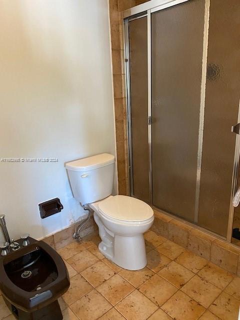 4450 Jog Road Greenacres, FL 33467 - Photo 11 of 18 a bathroom with a toilet and a sink