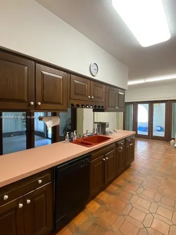 a view of a livingroom with a hard wood floor and a window