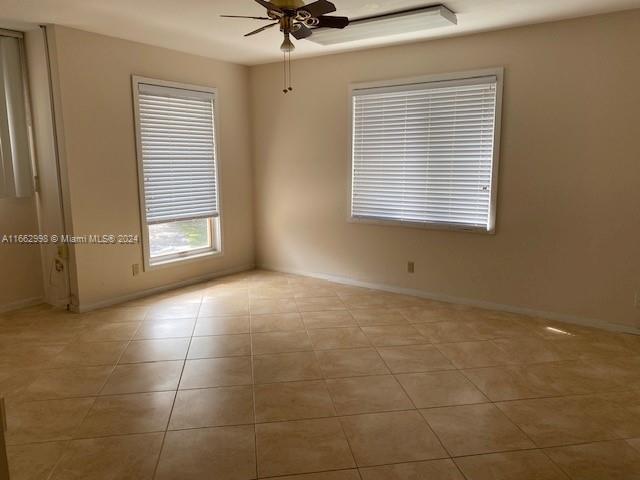 4450 Jog Road Greenacres, FL 33467 - Photo 9 of 18 a view of an empty room with a window