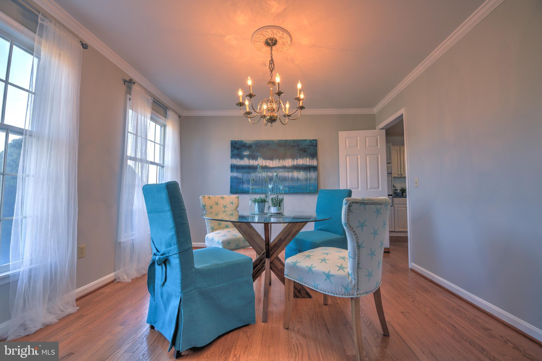 11489 Reed Circle Ridgely, MD 21660 - Photo 11 of 46 a view of a dining room with furniture window and wooden floor