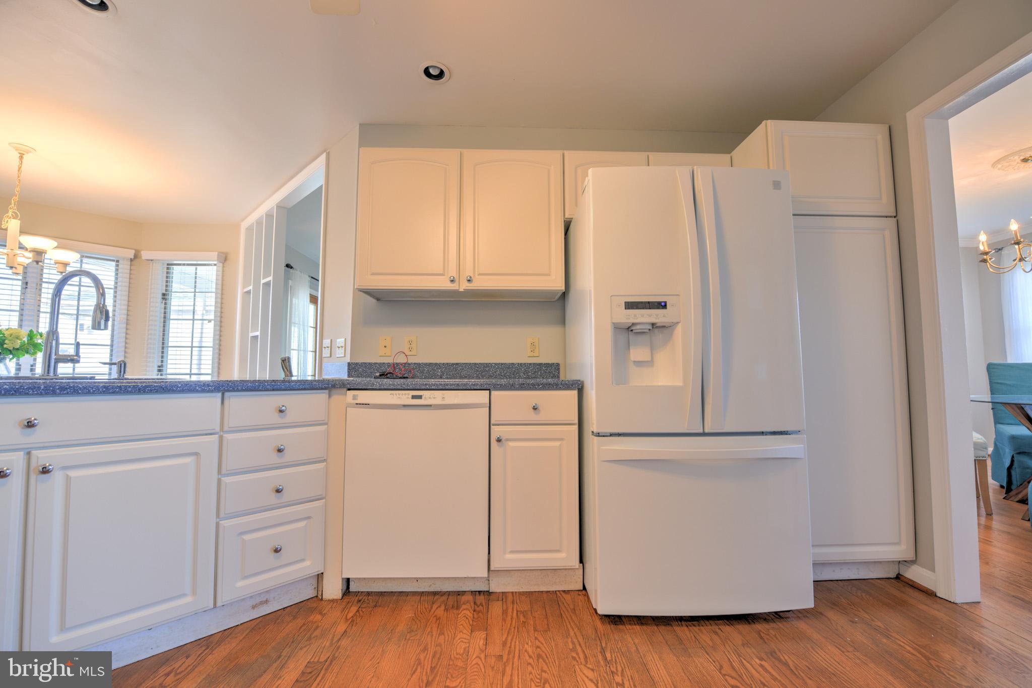 11489 Reed Circle Ridgely, MD 21660 - Photo 18 of 46 a kitchen with white cabinets and white stainless steel appliances