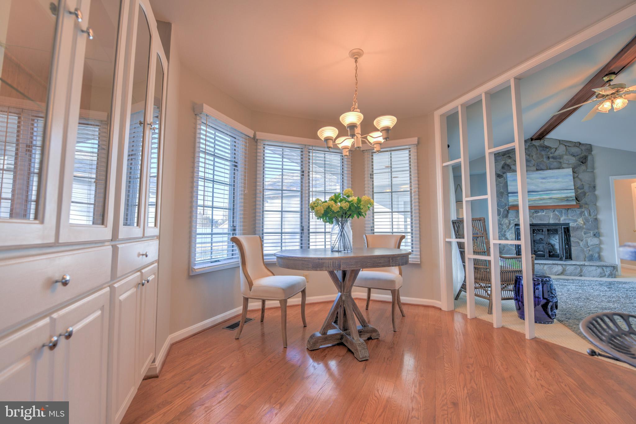 11489 Reed Circle Ridgely, MD 21660 - Photo 19 of 46 a view of a dining room with furniture wooden floor and chandelier
