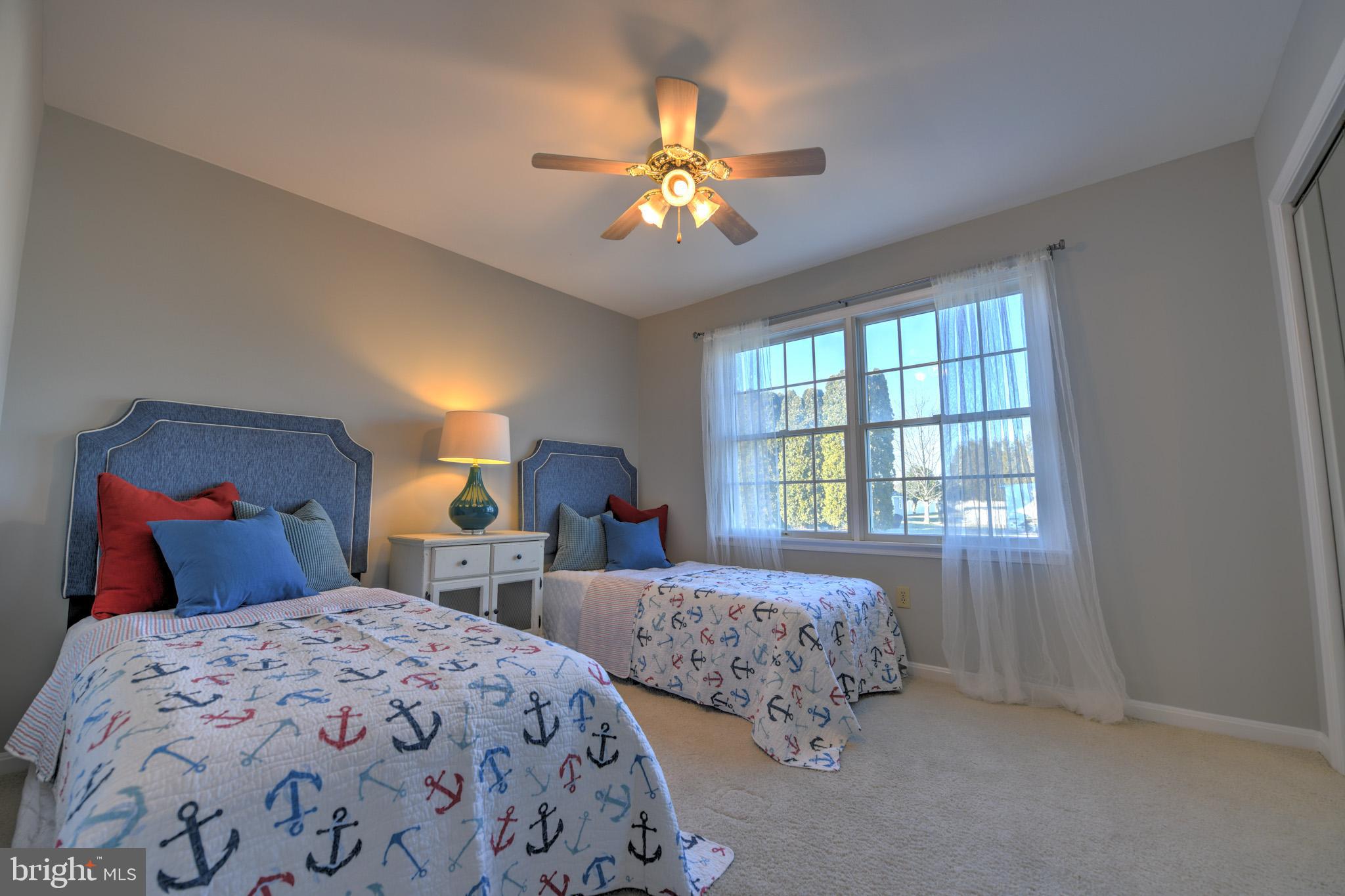 11489 Reed Circle Ridgely, MD 21660 - Photo 32 of 46 a bedroom with two beds and a window