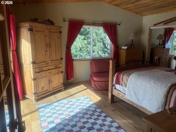 a bedroom with a bed and a cabinets