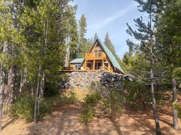 a view of house with trees in the background