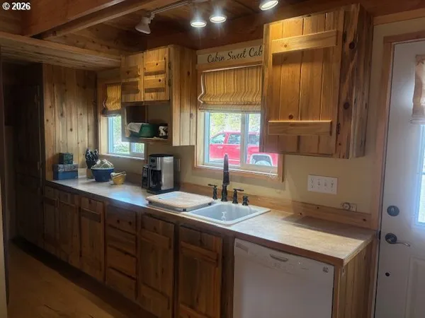 a kitchen with sink and window