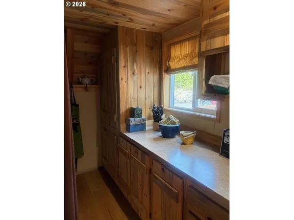 a stove top oven sitting inside of a kitchen