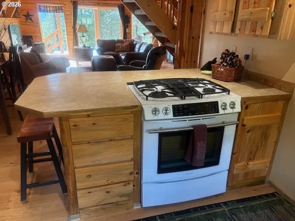a kitchen with a refrigerator and a stove