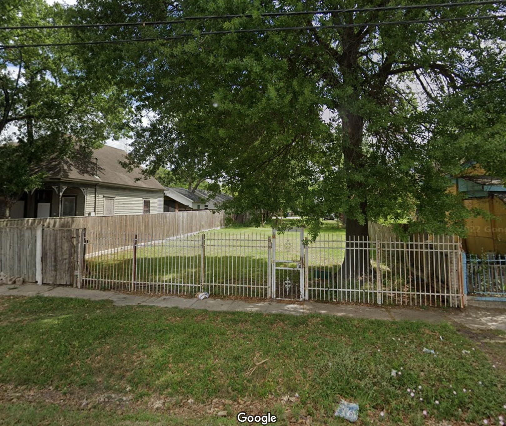 1912 Freeman Street Houston, TX 77009 - Photo 3 of 8 a view of a house with backyard and a garden