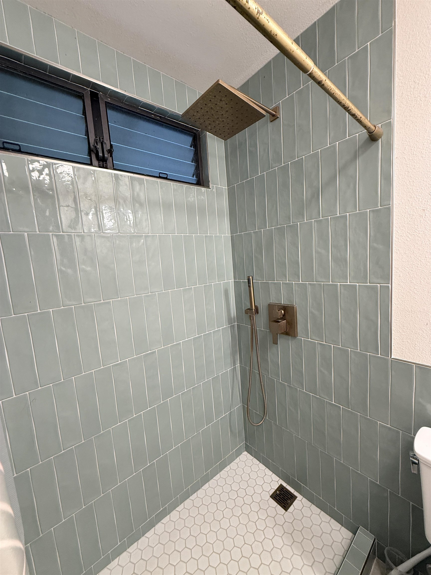580 A Lihau Place Haiku, HI 96708 - Photo 14 of 17 a bathroom with a shower and a sink