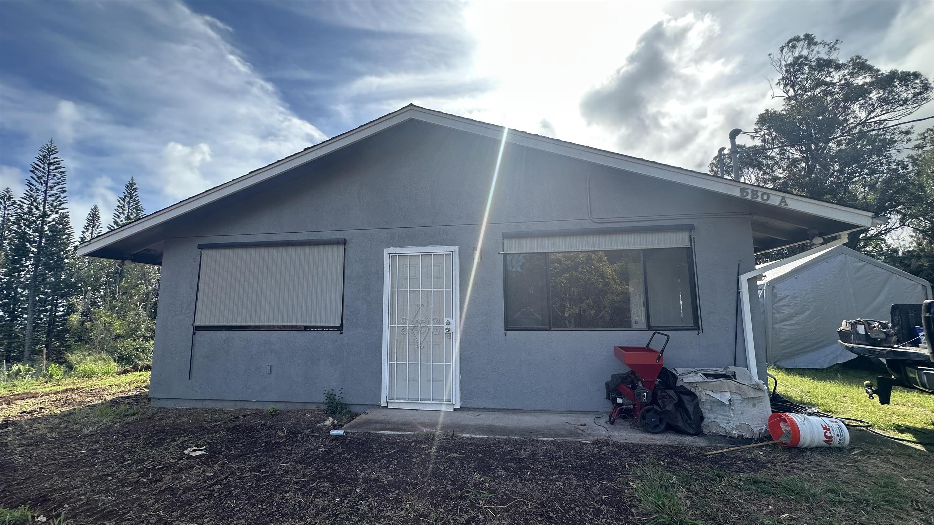 580 A Lihau Place Haiku, HI 96708 - Photo 2 of 17 a view of a house with backyard and entertaining space