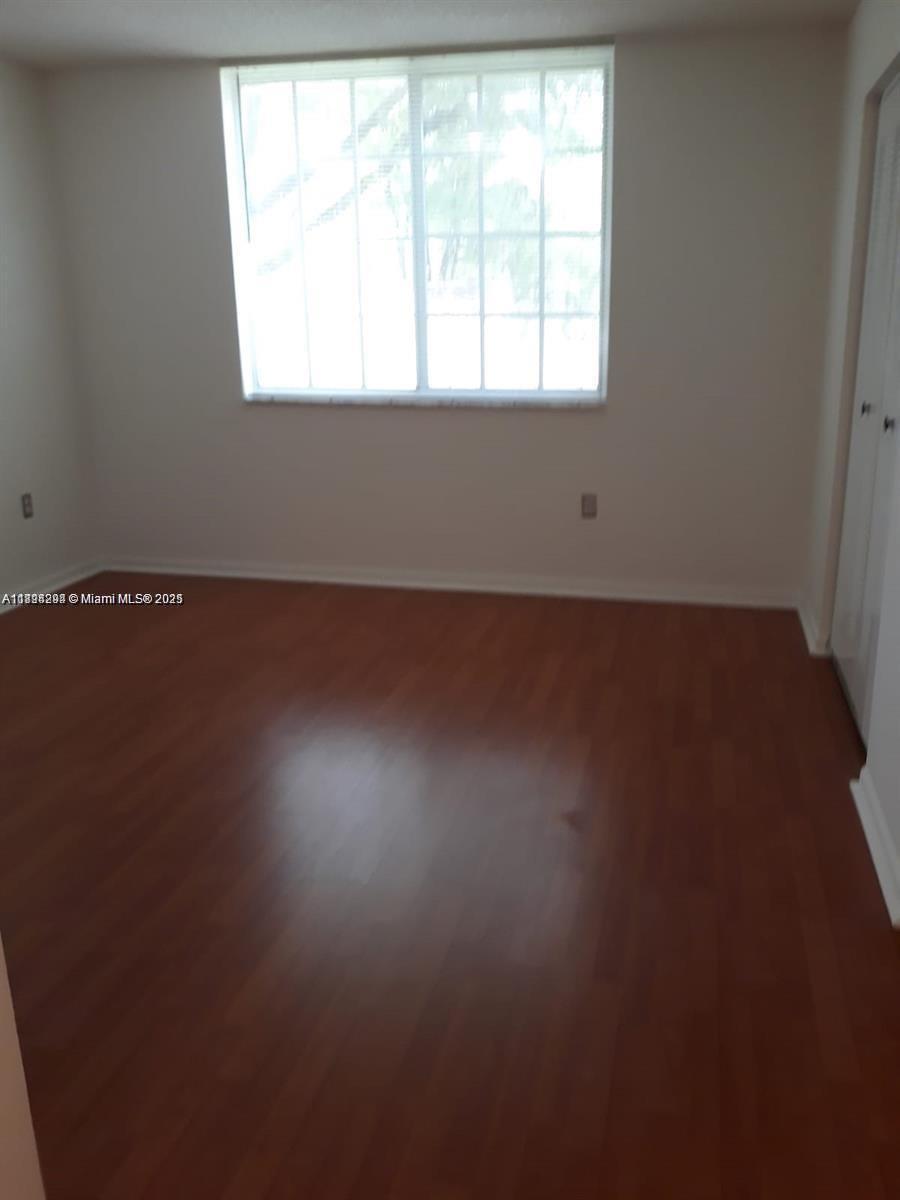 2123 Renaissance Boulevard, Unit 207 Miramar, FL 33025 - Photo 5 of 14 an empty room with a window