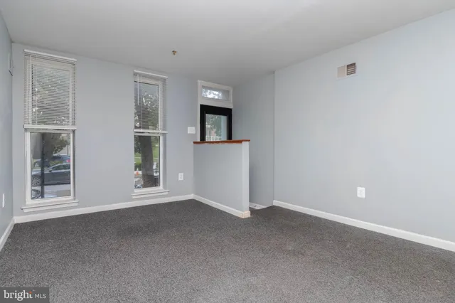 a view of empty room with windows