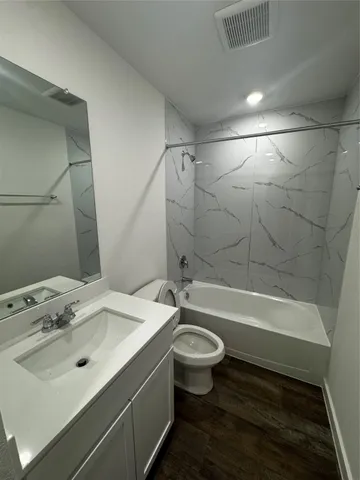 a bathroom with a sink toilet bathtub and shower