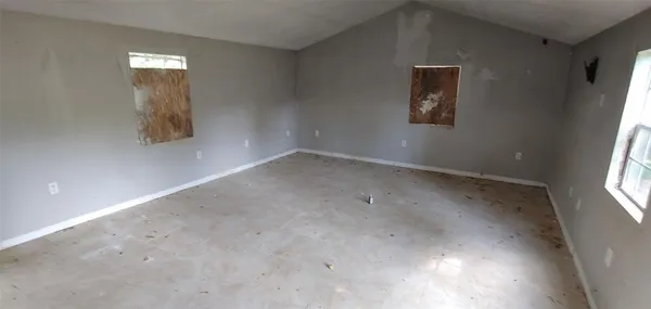 an empty room with windows