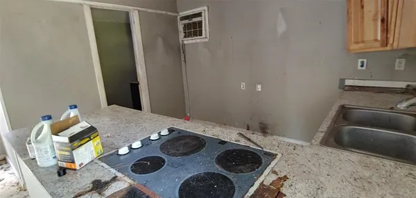 a bedroom with a bed and a stove