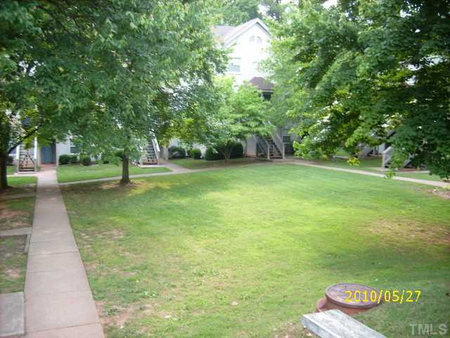 2520 Avent Ferry Road, Unit 201 Raleigh, NC 27606 - Photo 8 of 10 Front of townhome overlooks tree filled courtyard.