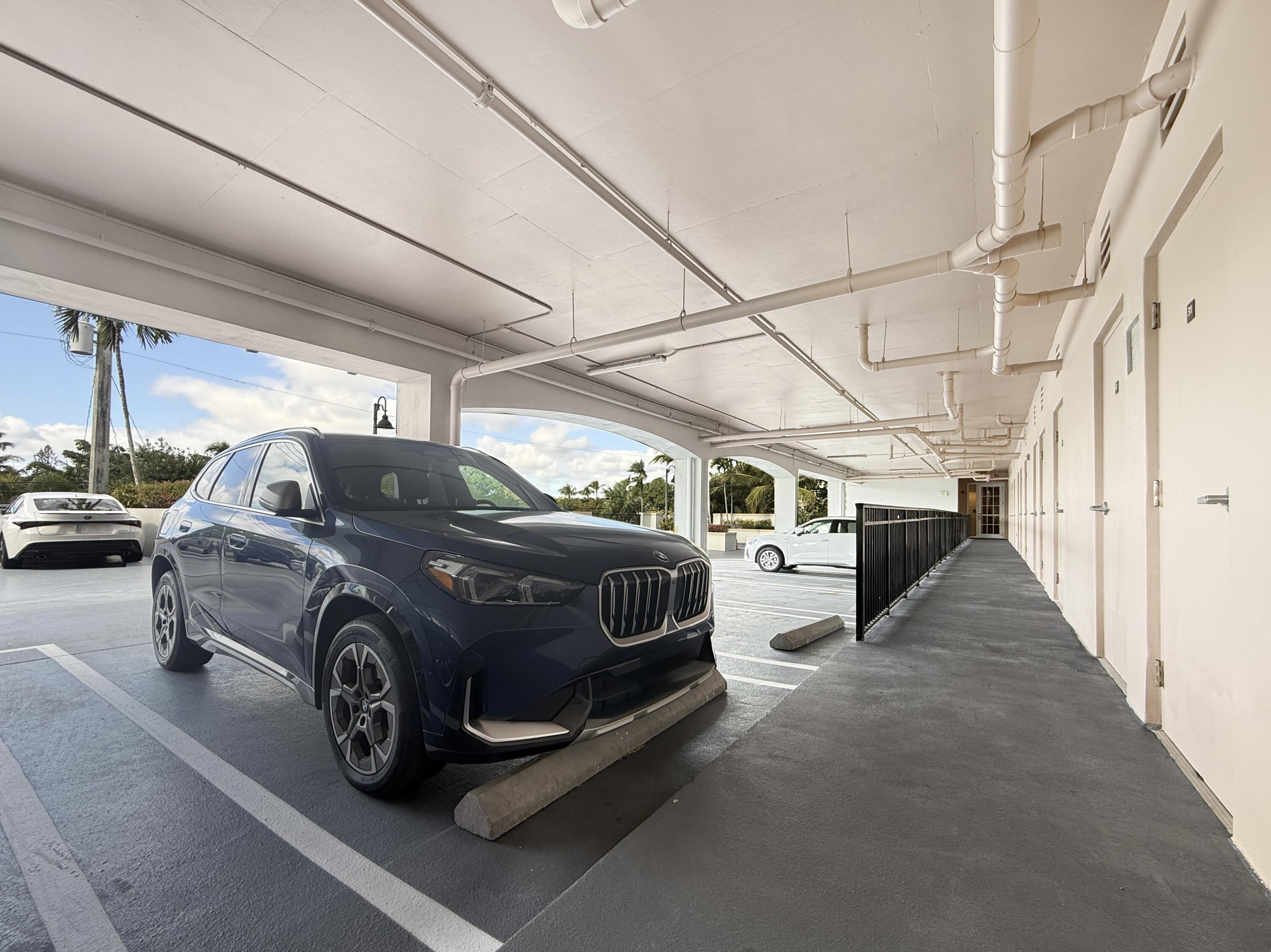 200 Northeast 2nd Avenue, Unit 414 Delray Beach, FL 33444 - Photo 12 of 16 a view of a car in garage