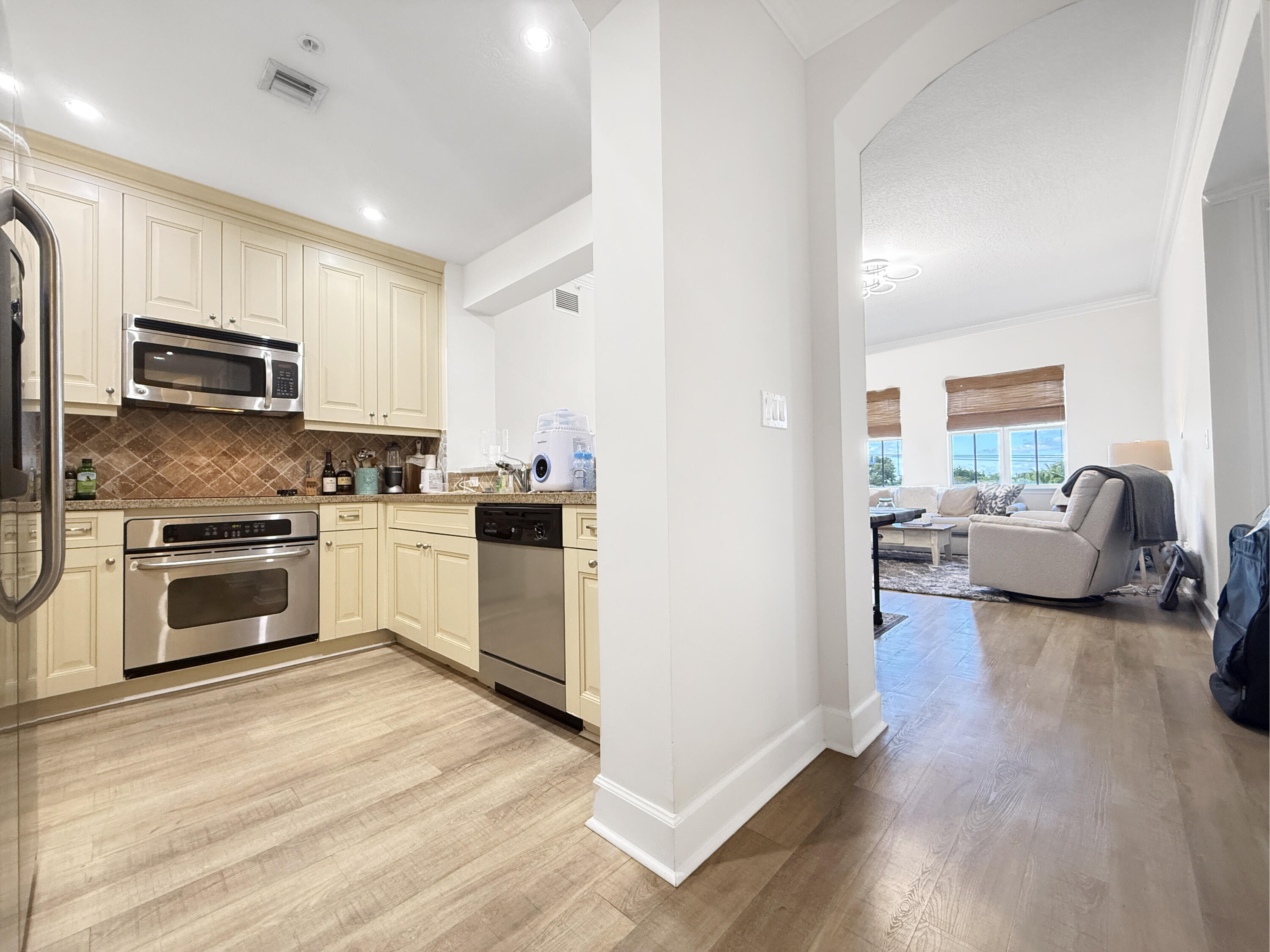200 Northeast 2nd Avenue, Unit 414 Delray Beach, FL 33444 - Photo 2 of 16 a kitchen with sink a microwave and cabinets