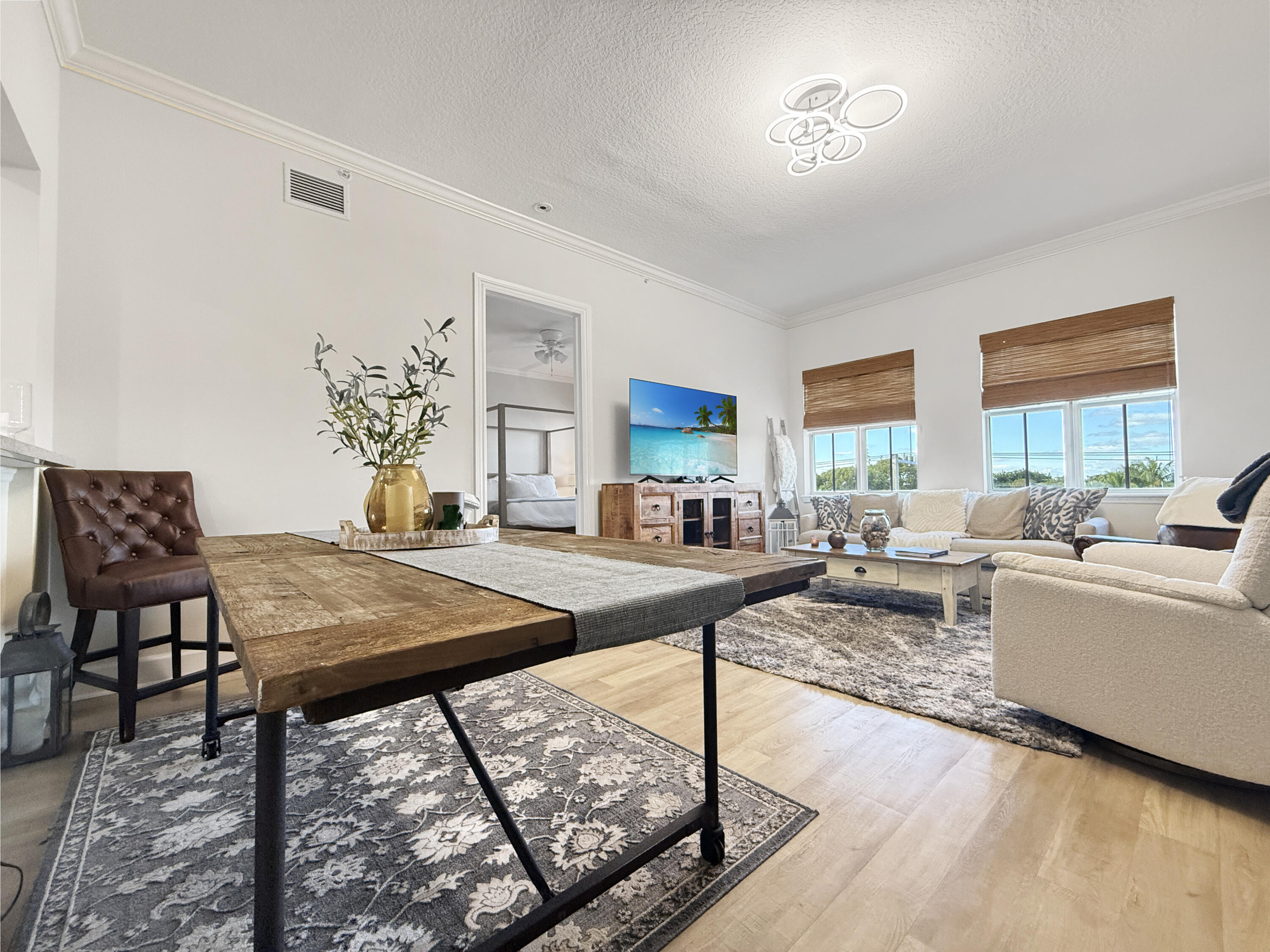 200 Northeast 2nd Avenue, Unit 414 Delray Beach, FL 33444 - Photo 3 of 16 a living room with furniture and a table