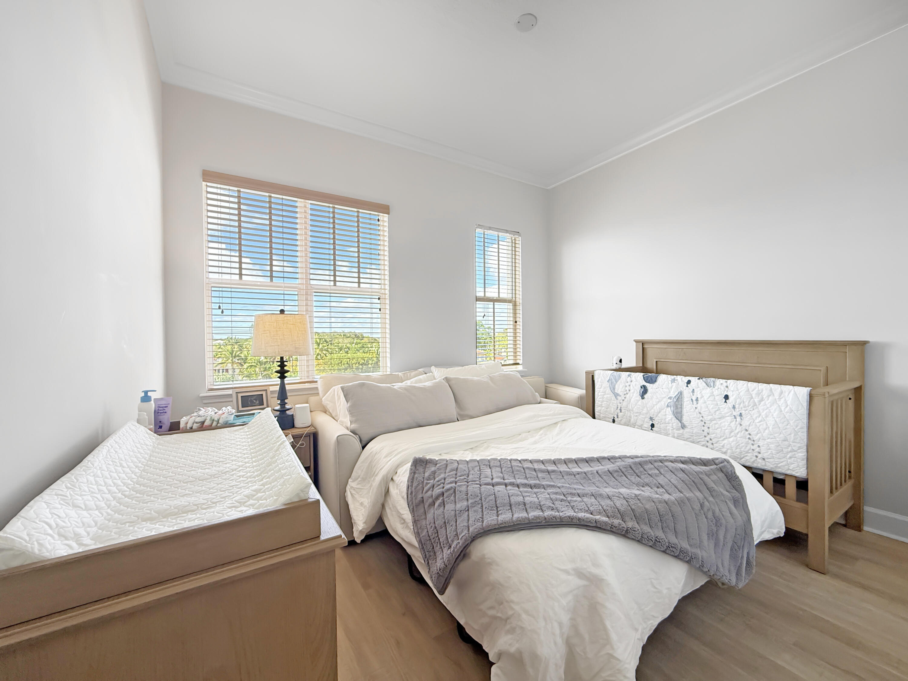 200 Northeast 2nd Avenue, Unit 414 Delray Beach, FL 33444 - Photo 8 of 16 a bedroom with a bed and two window