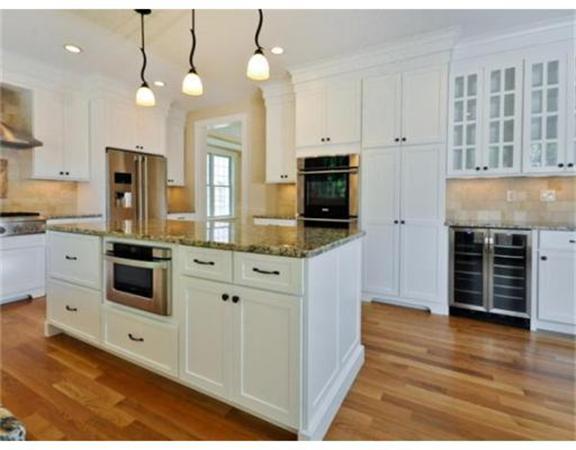 82 Grosvenor Road Needham, MA 02492 - Photo 8 of 10 a kitchen with stainless steel appliances a stove a sink and white cabinets