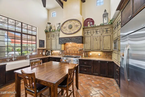 a bathroom with a double vanity sink and mirror
