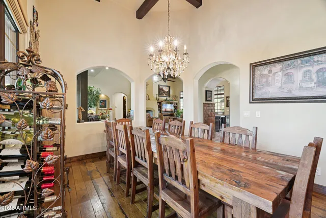 a en suite bathroom with a granite countertop double vanity sink and a mirror