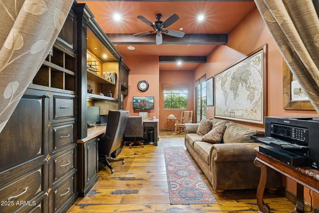 a bathroom with a granite countertop sink a toilet a mirror and shower