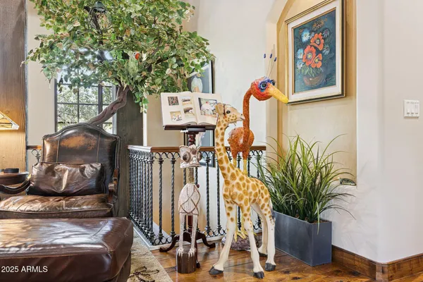a utility room with stainless steel appliances a sink and cabinets