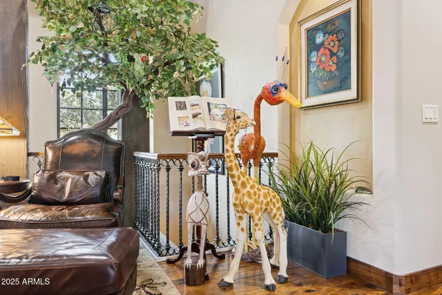 a utility room with stainless steel appliances a sink and cabinets