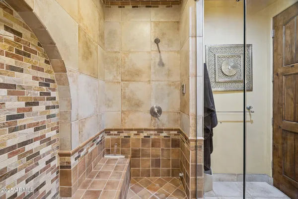 a view of a patio with a dining table and chairs