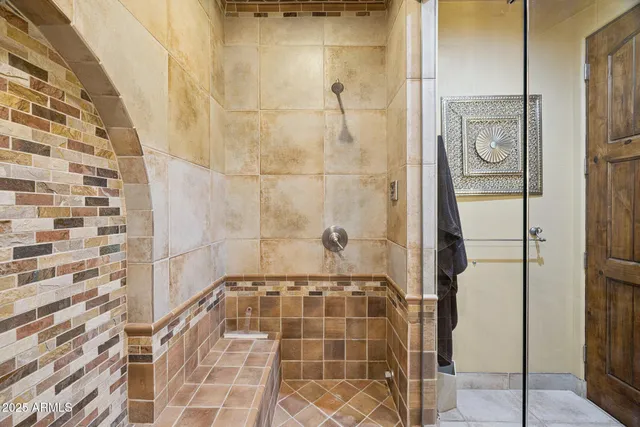 a view of a patio with a dining table and chairs