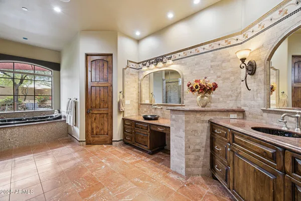 a view of swimming pool with outdoor seating and plants