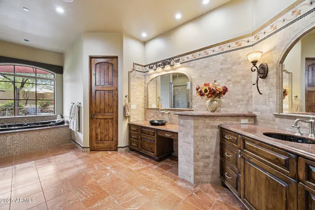 a view of swimming pool with outdoor seating and plants