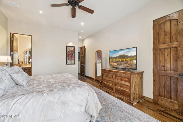 a living room with furniture a rug and a chandelier