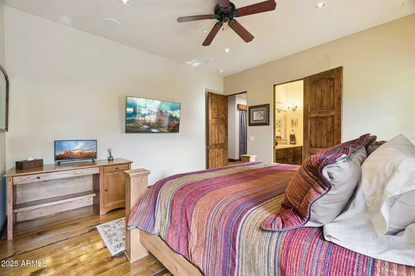 a living room with furniture a window and a projector