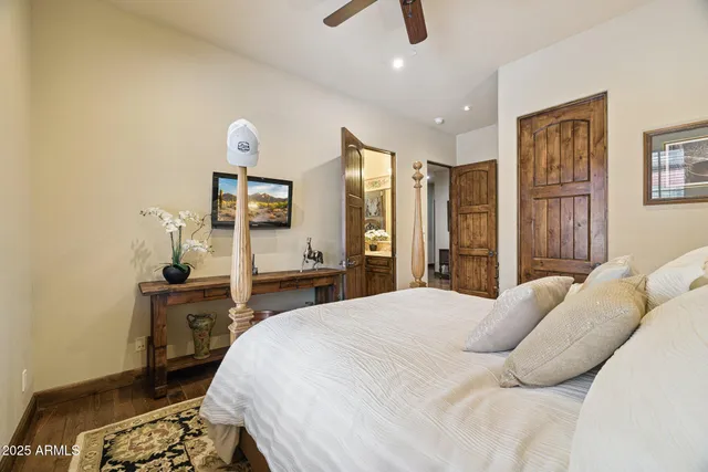 a living room with furniture a chandelier and a rug