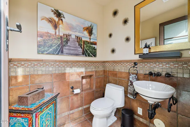 a spacious bedroom with a bed dresser and a window