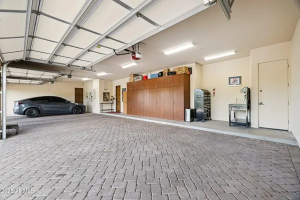 an aerial view of a house with a mountain in the background