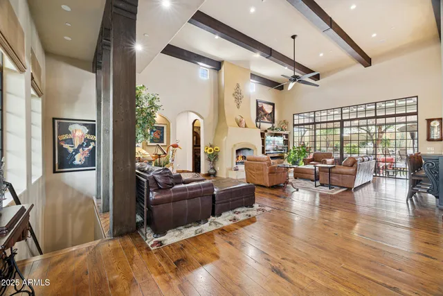 a view of a dining room with furniture and a clock
