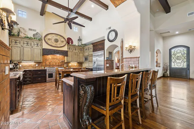 a living room with furniture a rug and a chandelier
