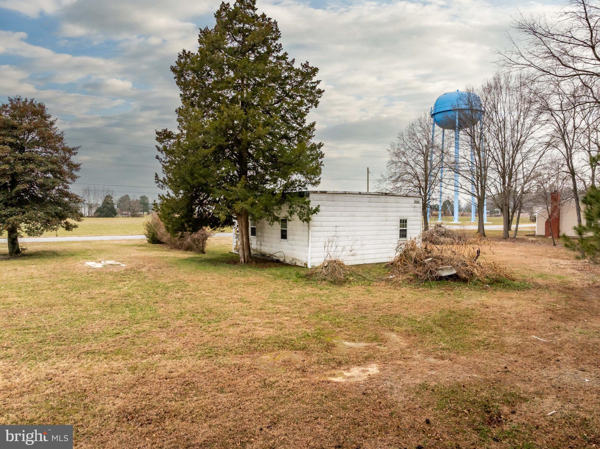 9571 Legion Road Denton, MD 21629 - Photo 19 of 26 a view of a yard with a house and garden