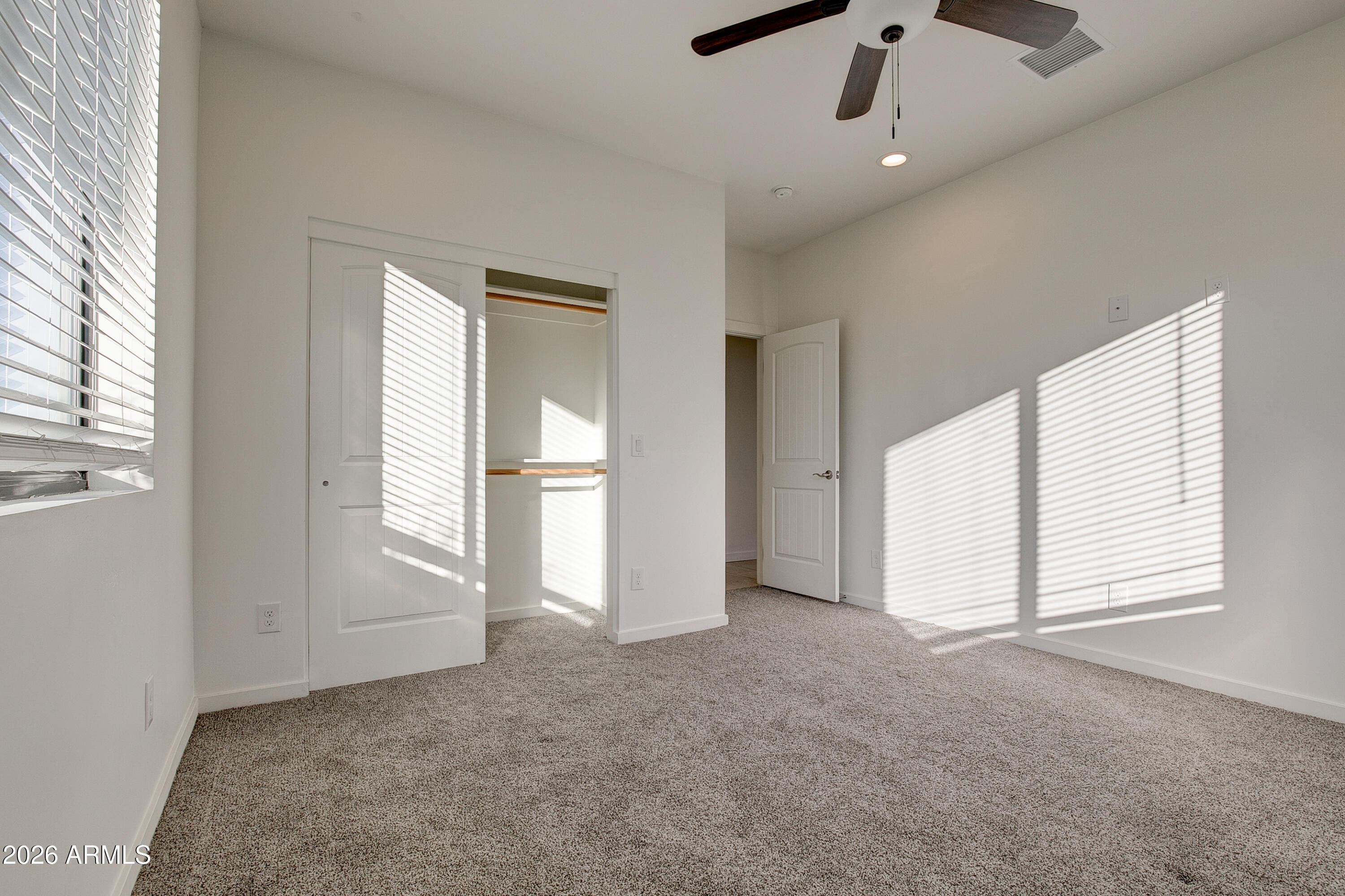 16075 North 30th Street Phoenix, AZ 85032 - Photo 18 of 41 a view of empty room with windows