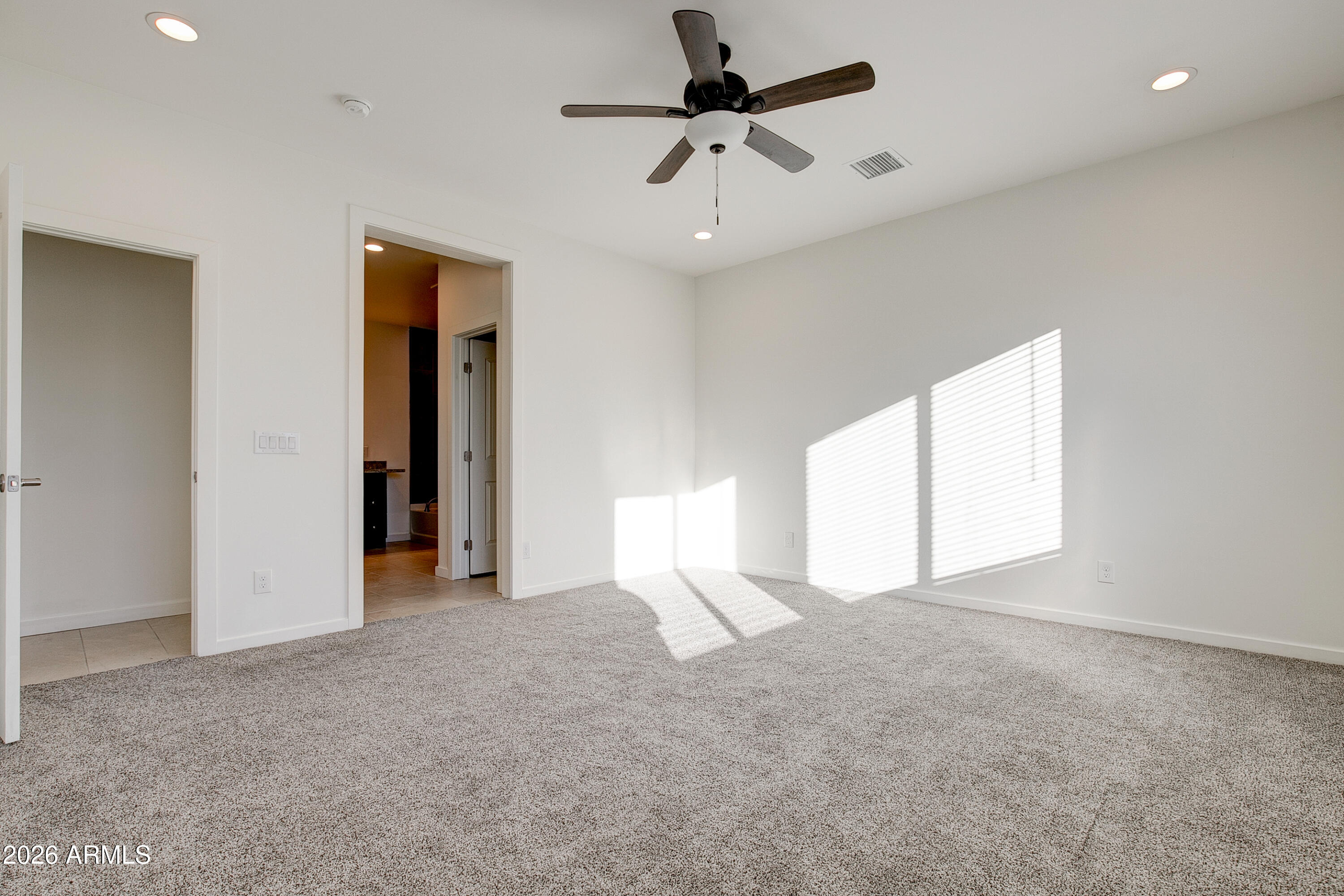 16075 North 30th Street Phoenix, AZ 85032 - Photo 20 of 41 a view of empty room with ceiling fan