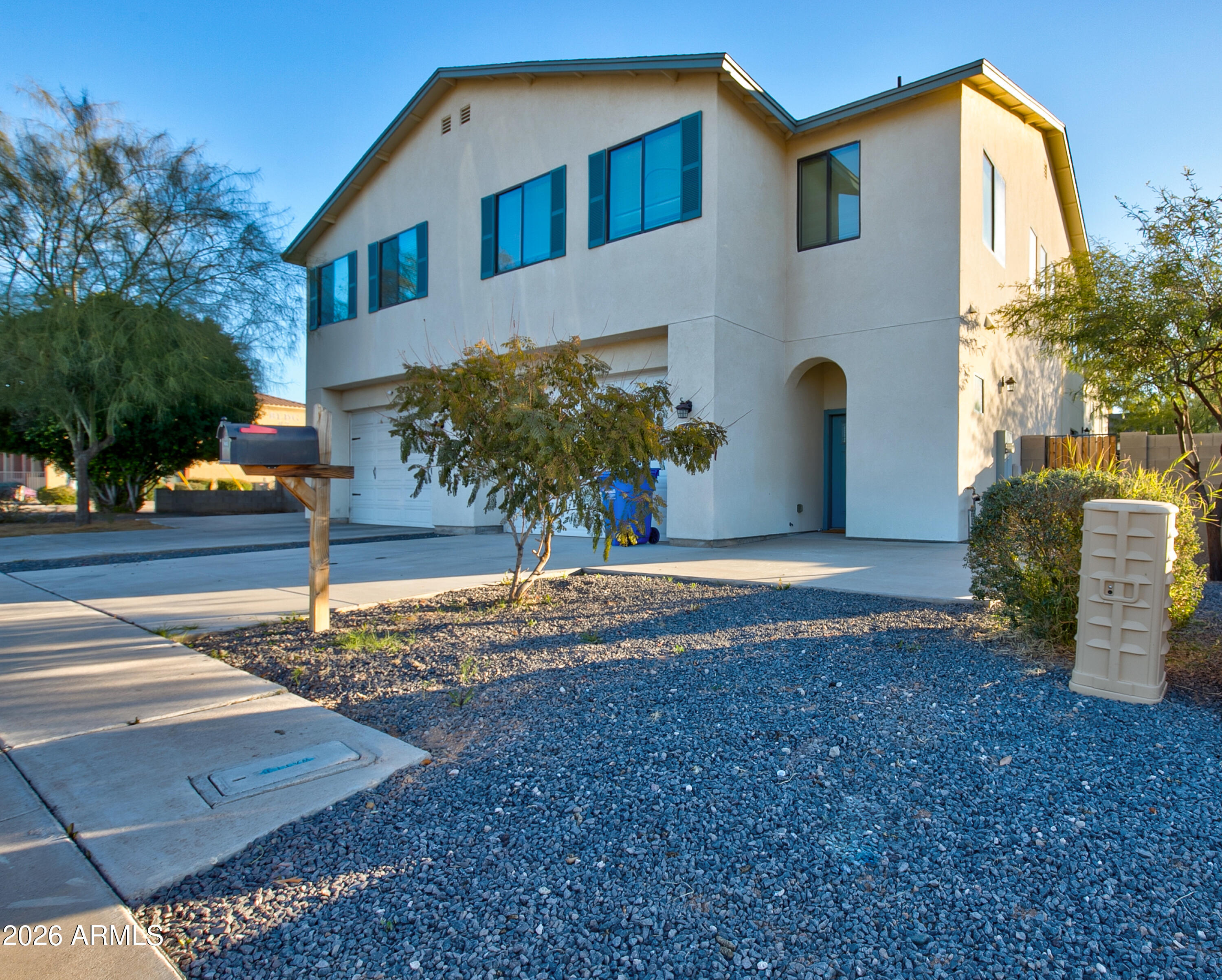 16075 North 30th Street Phoenix, AZ 85032 - Photo 2 of 41 a front view of a house with garden
